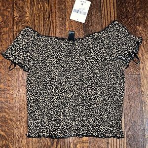 Forever 21, ruched off the shoulder formfitting crop top.
Super trendy and cute.